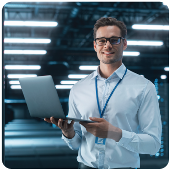 IT guy standing with a laptop